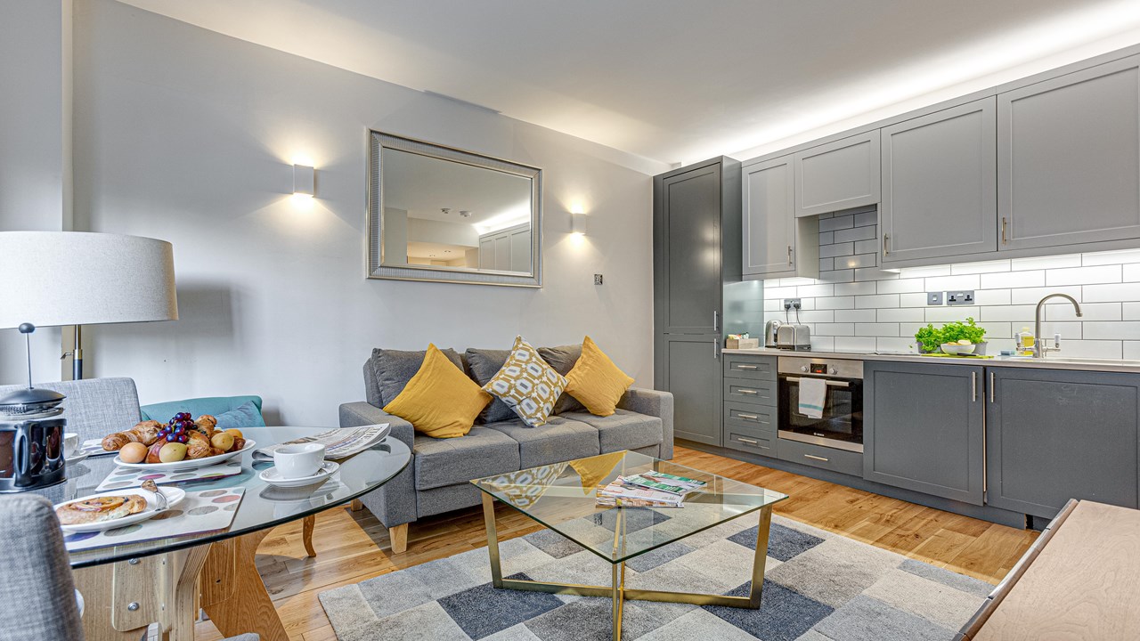 Apartment 440 — sitting area with orange armchairs